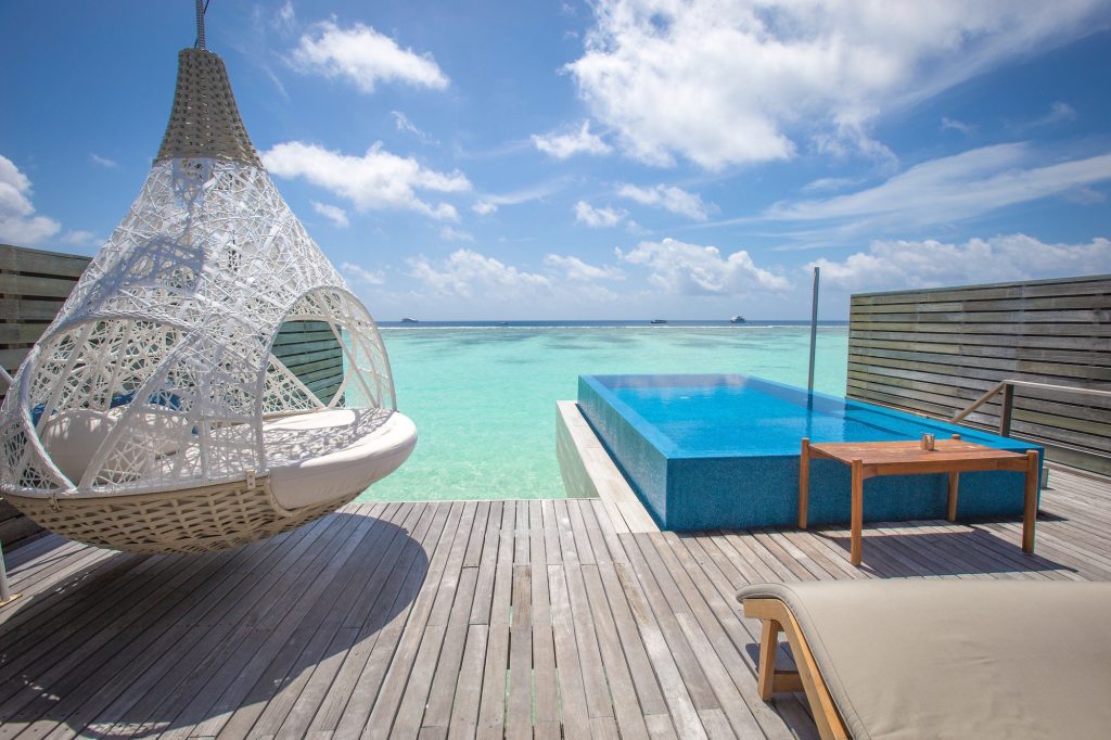 Ocean view from a water bungalow. Pool by the ocean in Maldives